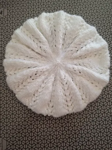 The beret is white.